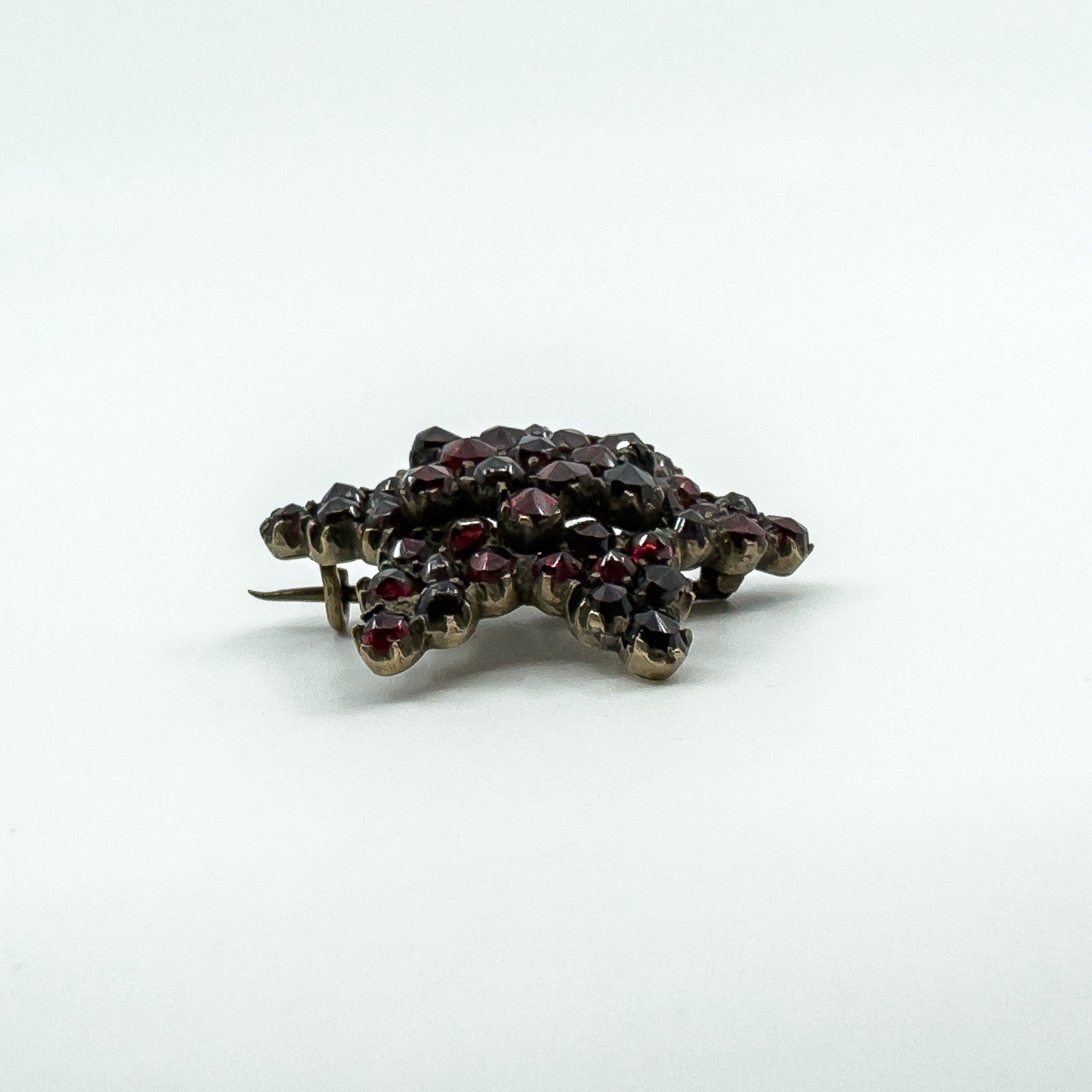 Antique Silver Gilt Bohemian Rose Cut Garnet Star Brooch