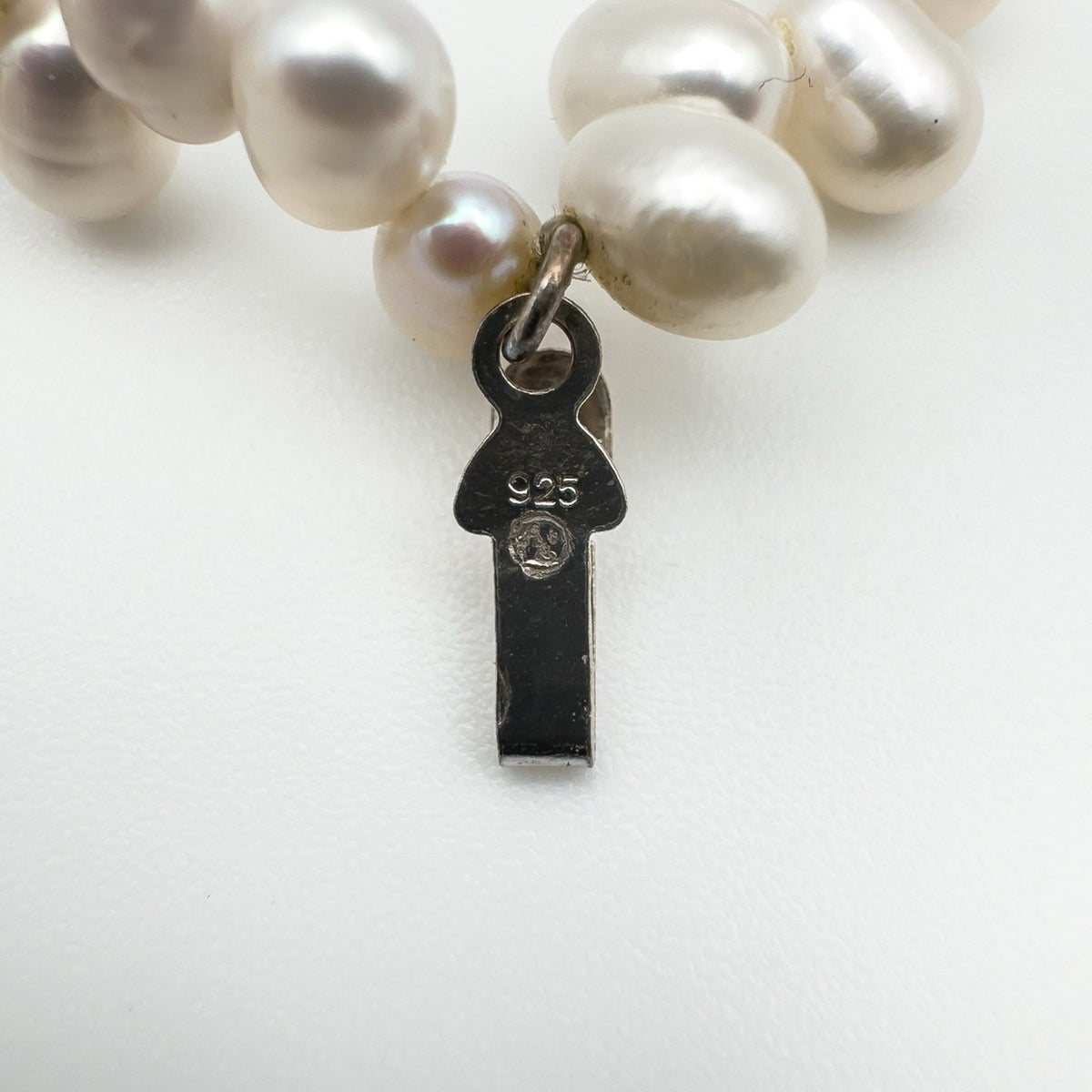 Sterling silver 925 hallmark tag on pearl bracelet clasp