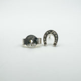 Close-up of 925 stamp on butterfly back and horseshoe earring