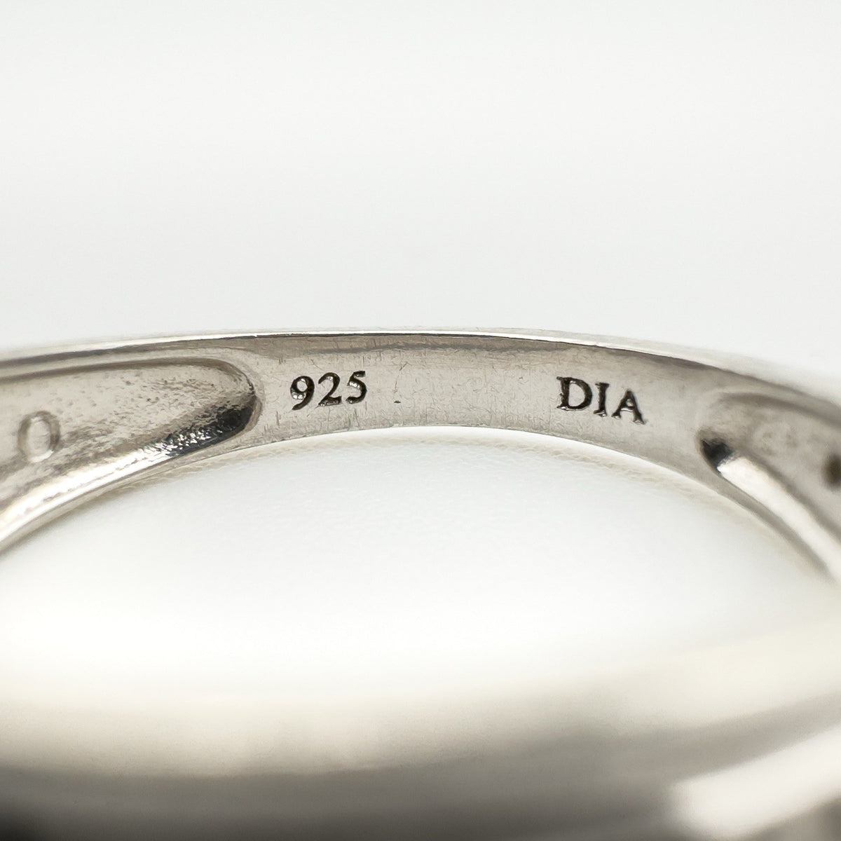 Close-up of sterling silver ring hallmarked 925 and DIA inside the band