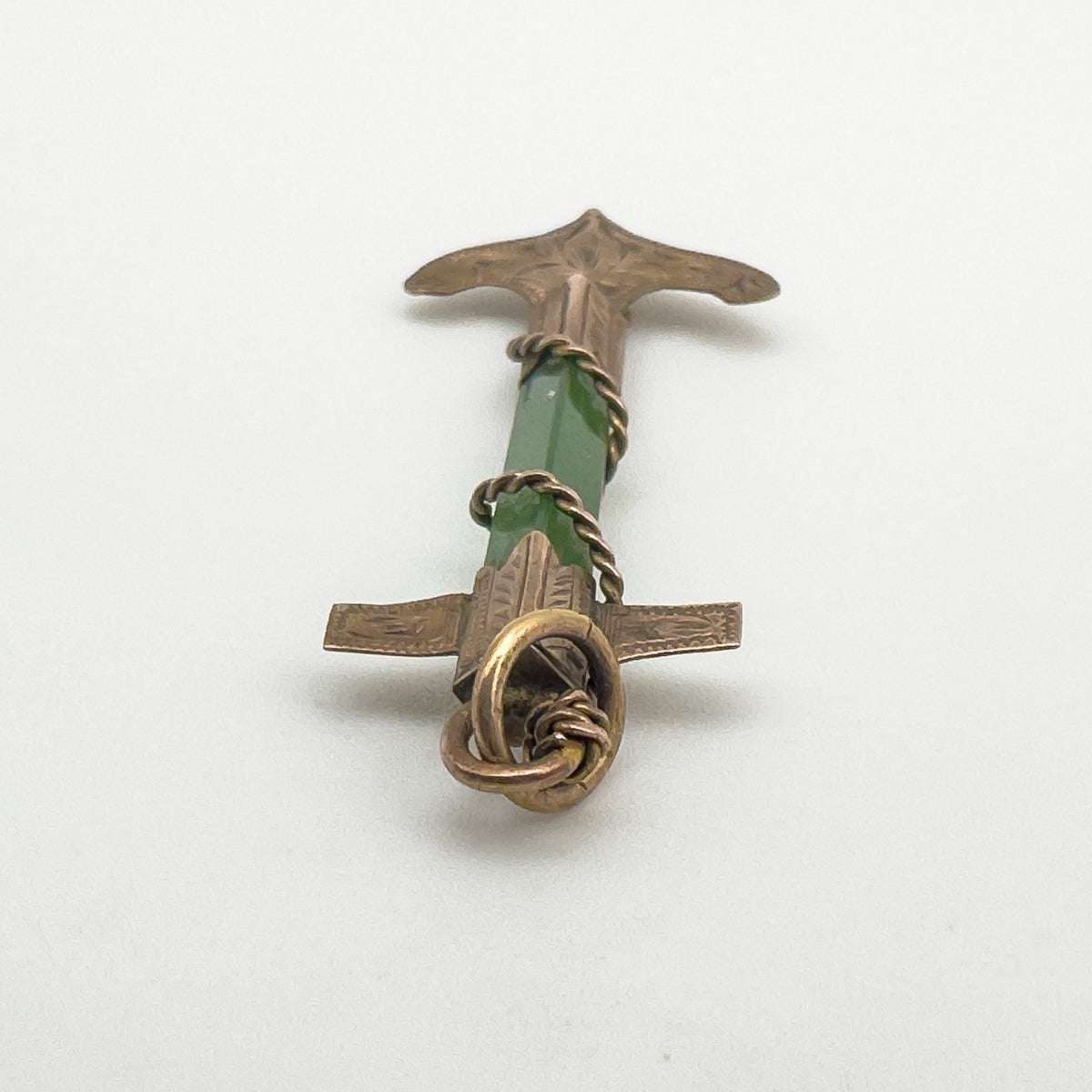 Bail and twisted gold wire detailing at the top of the antique pendant