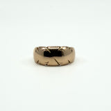 Straight-on view of antique 12ct rose gold wide band ring Size J, showing domed band and engraving
