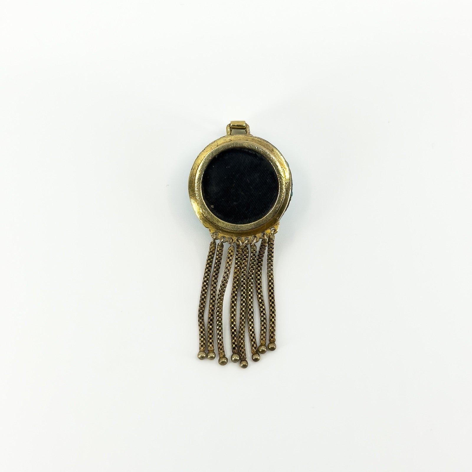 Reverse of Victorian 18ct gold tassel locket showing the removable glass-backed keepsake compartment.