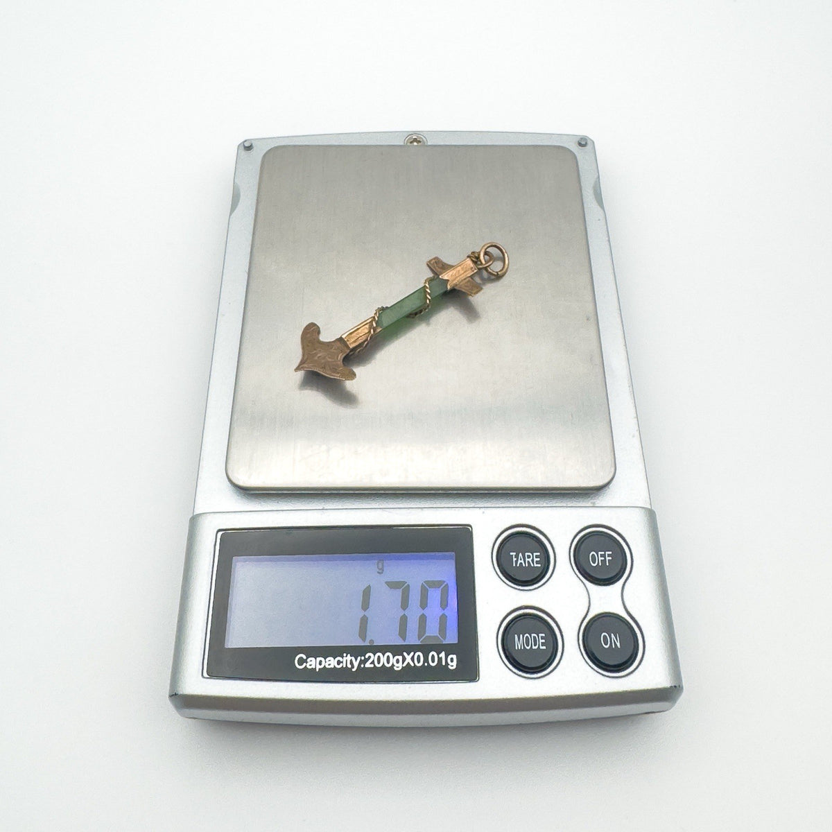 Pendant weighed on digital scale showing 1.7g