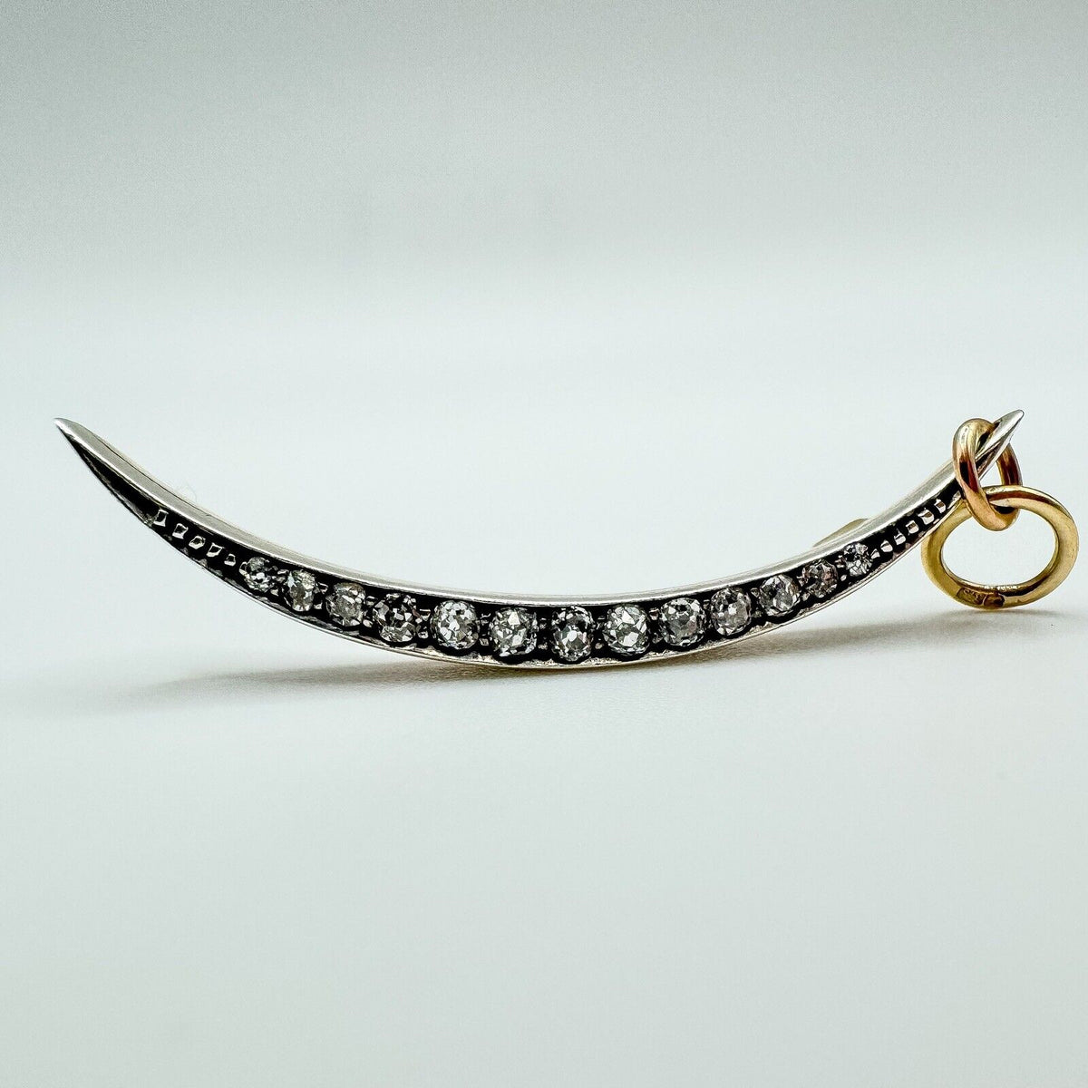 Antique crescent moon pendant set with old cut diamonds in silver and 18ct rose gold