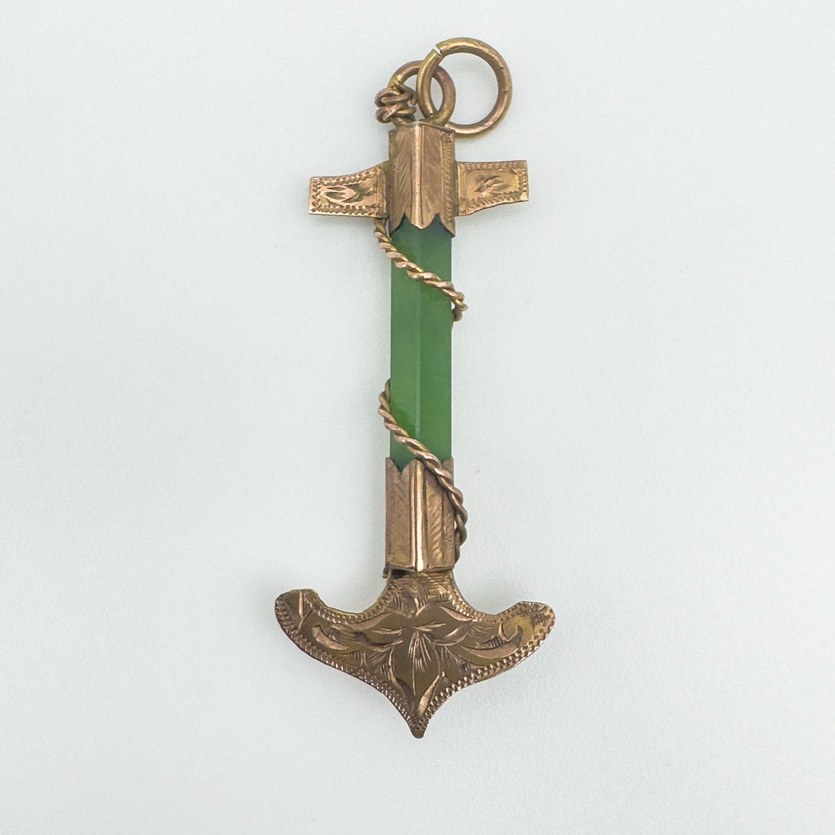 Front view of antique 9ct rose gold anchor pendant set with green jade