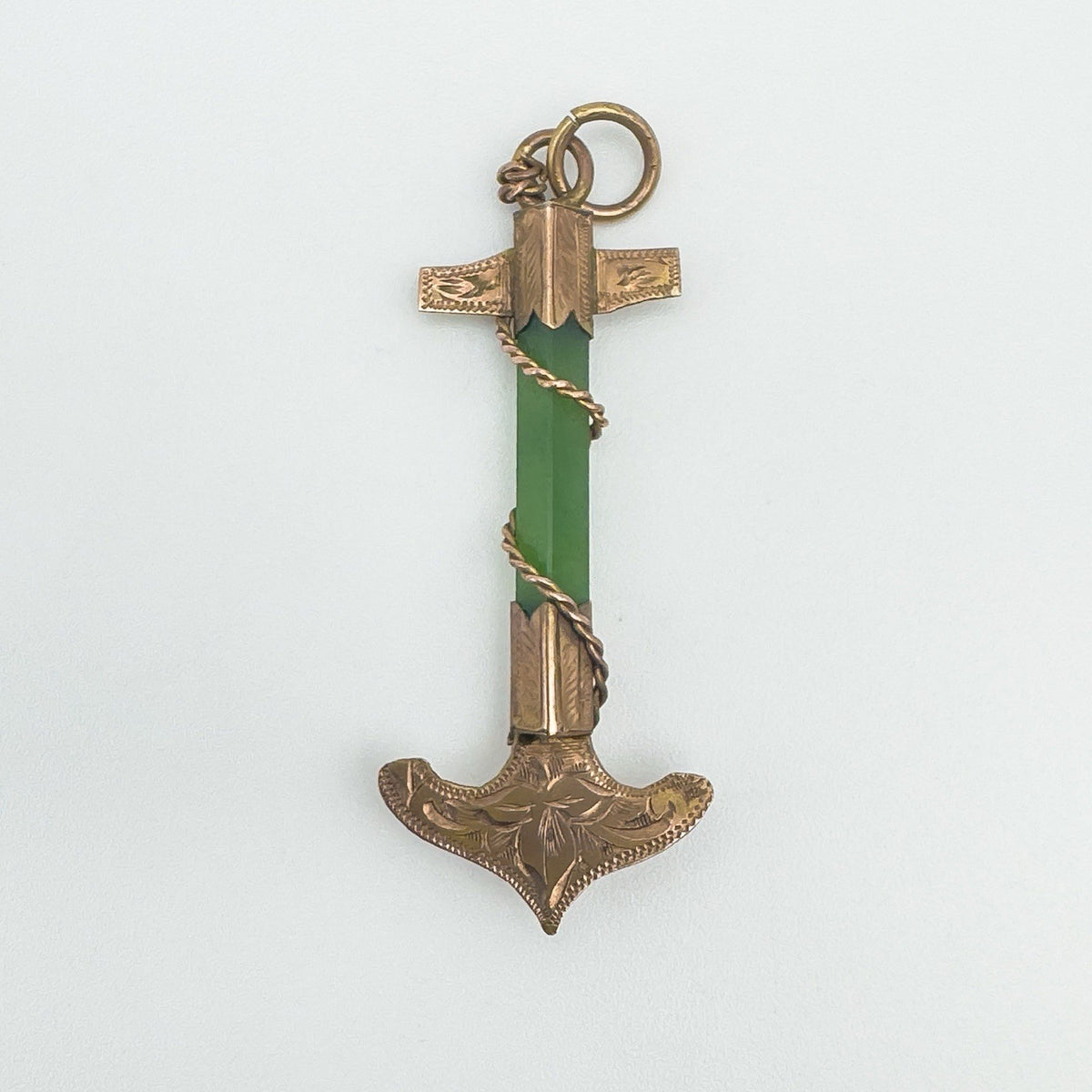 Front-facing view of engraved 9ct rose gold anchor pendant with green jade