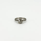 Front view of antique platinum old-cut diamond solitaire ring with engraved shoulders