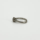Side profile of antique old-cut diamond solitaire ring with PLAT mark visible inside the band