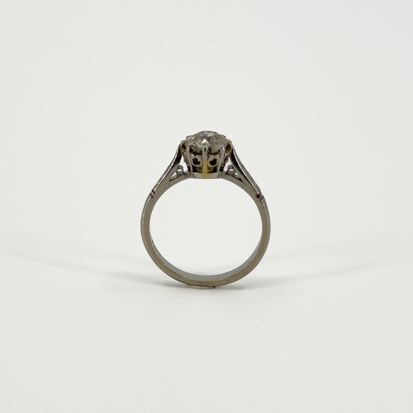 Rear view of antique platinum old-cut diamond solitaire ring showing open gallery setting