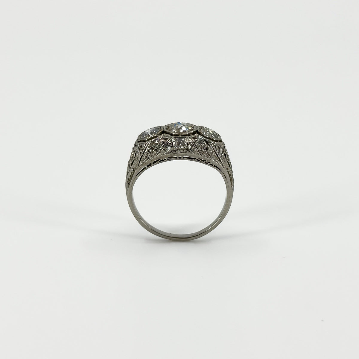 Side view of Art Deco platinum diamond ring showing pierced filigree gallery