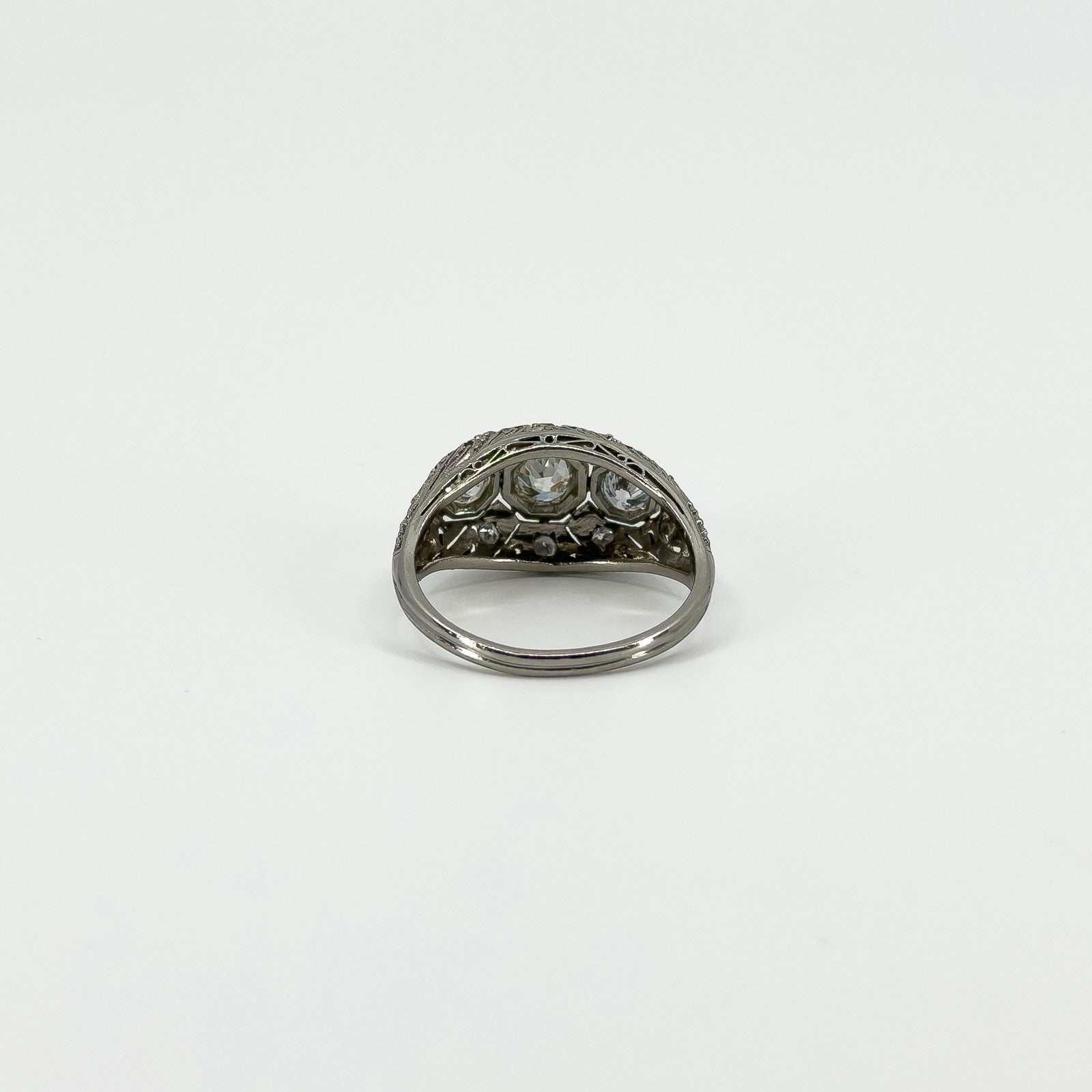 Rear view of Art Deco platinum diamond ring showing openwork beneath the stones