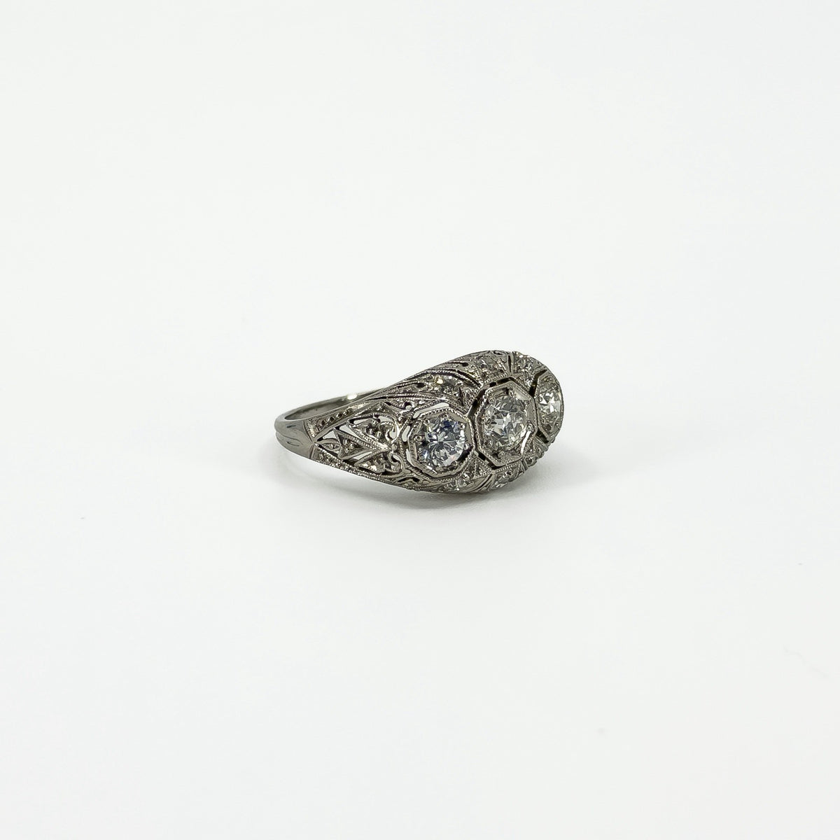 Side profile of Art Deco platinum ring showing filigree openwork and diamond setting