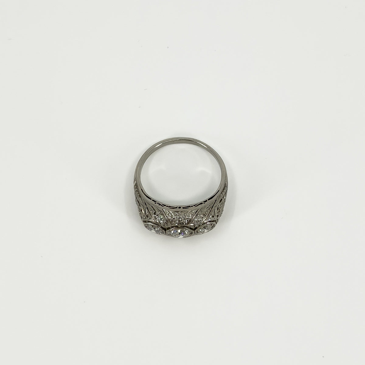 Underside view of platinum diamond ring showing the pierced gallery