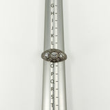 Art Deco platinum diamond trilogy ring shown on a metal ring sizer