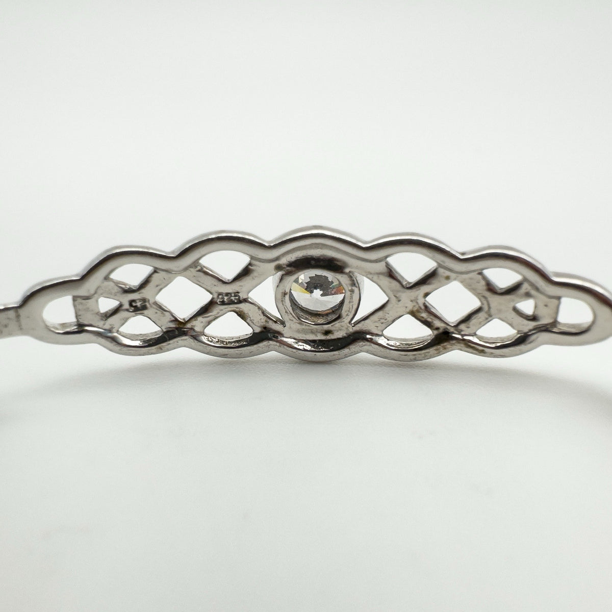 Reverse view showing openwork Celtic pattern and CZ setting from the back