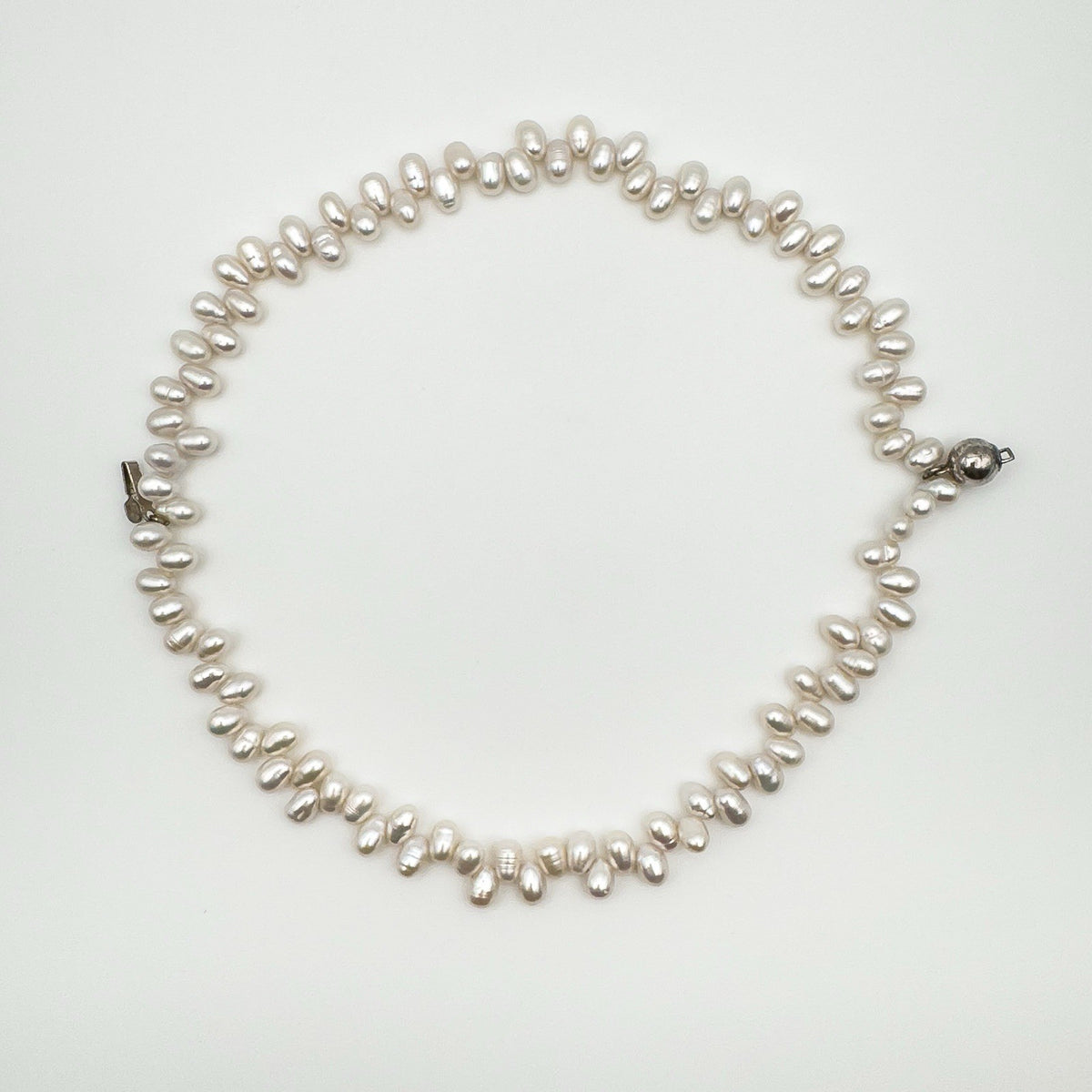 Full view of double strand baroque pearl bracelet in silver