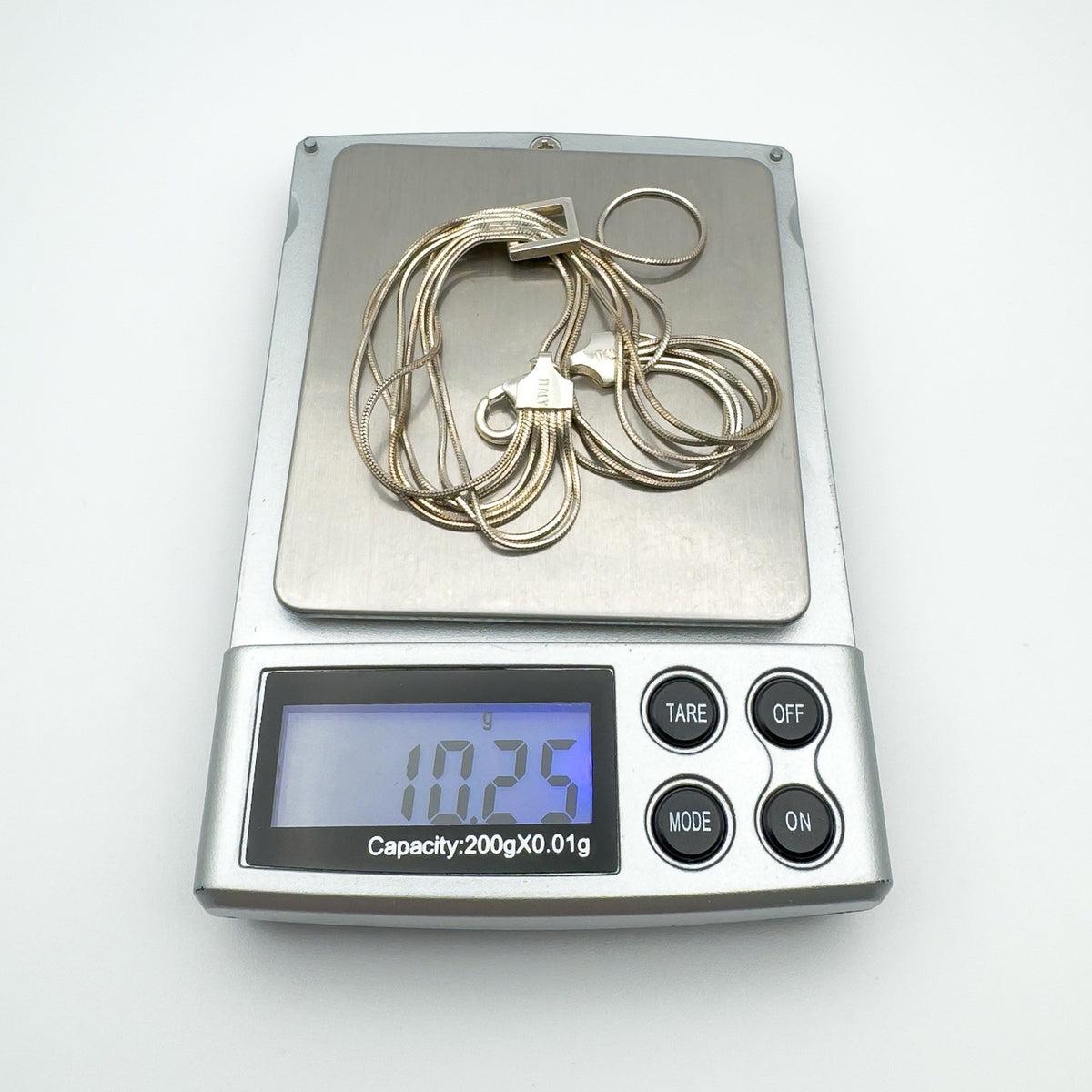 Multi strand sterling silver bracelet weighing 10.25g on digital scale