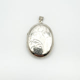 Large sterling silver locket with foliate engraving