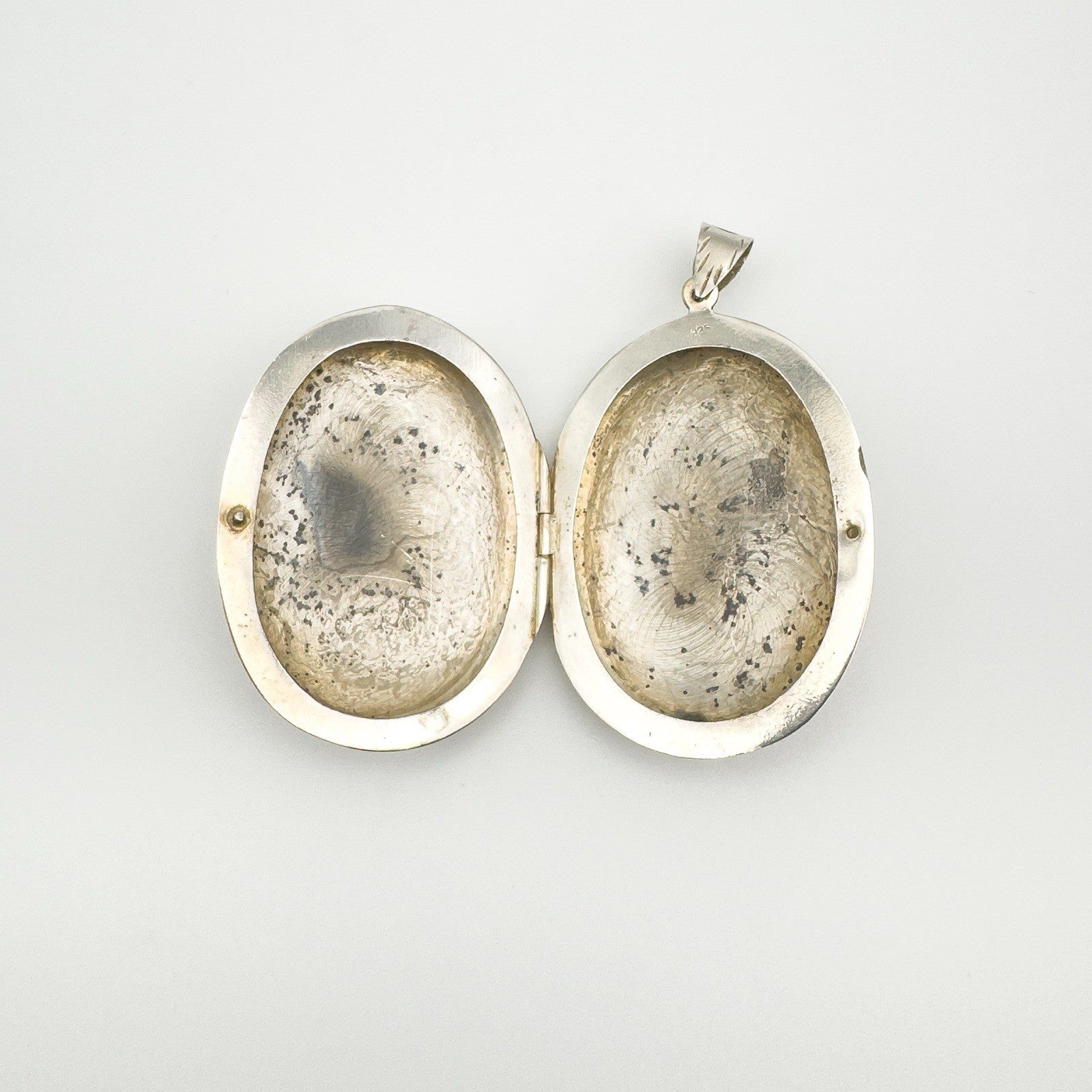 Inside of oval silver locket
