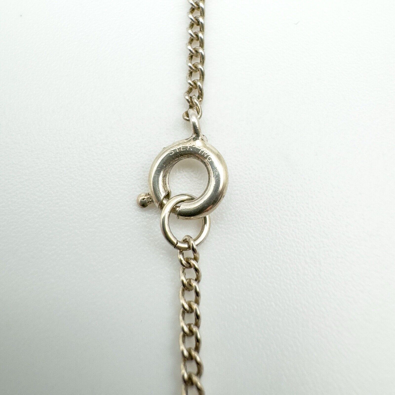 Spring ring clasp stamped STERLING on 24 inch silver curb chain