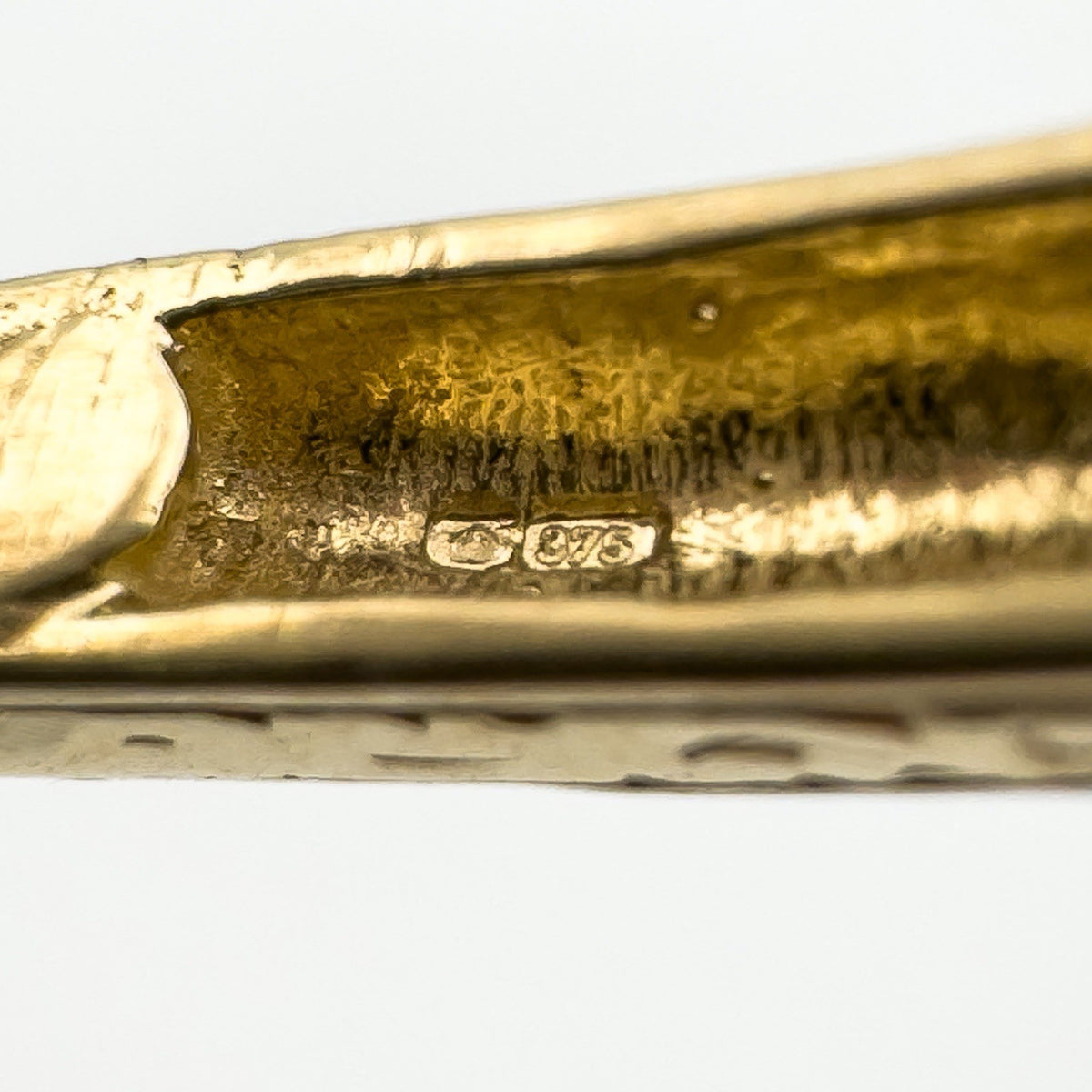 Close-up showing 375 Birmingham hallmark inside 9ct gold bangle