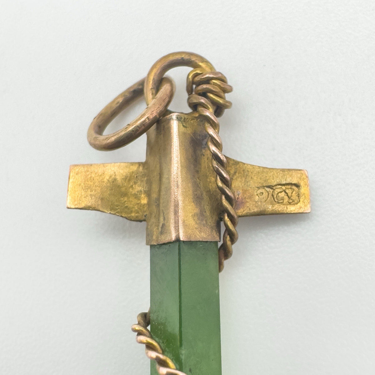 Detailed view of maker's mark stamped on the gold anchor crossbar