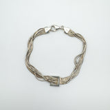 Sterling silver snake box chain bracelet laid flat with square centre