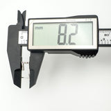 Digital caliper showing width of sterling silver J hoop earring as 8.2mm