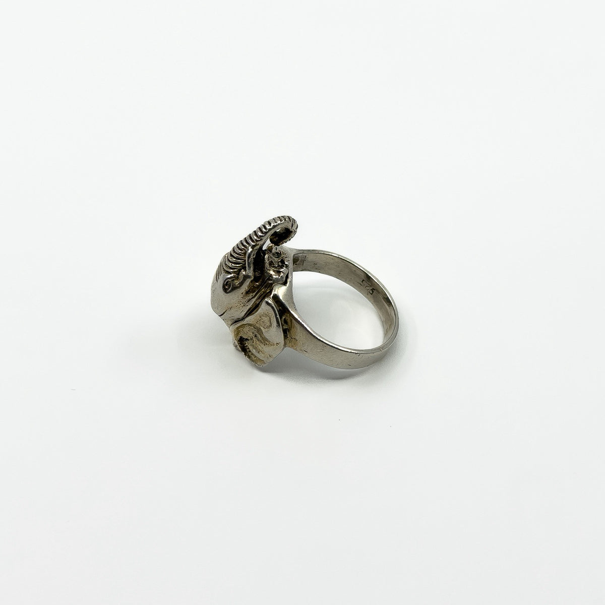 Side view of vintage sterling silver elephant locket ring with hinged head detail