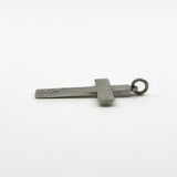 Side view of the vintage sterling silver engraved cross pendant showing the slim profile.