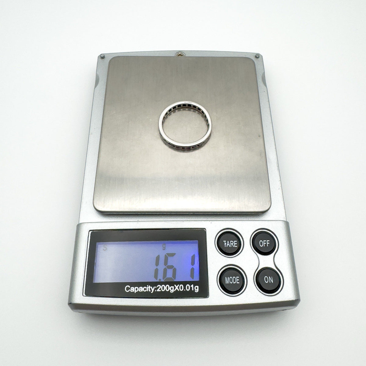 White gold full eternity ring weighing 1.61g on digital jewellery scale