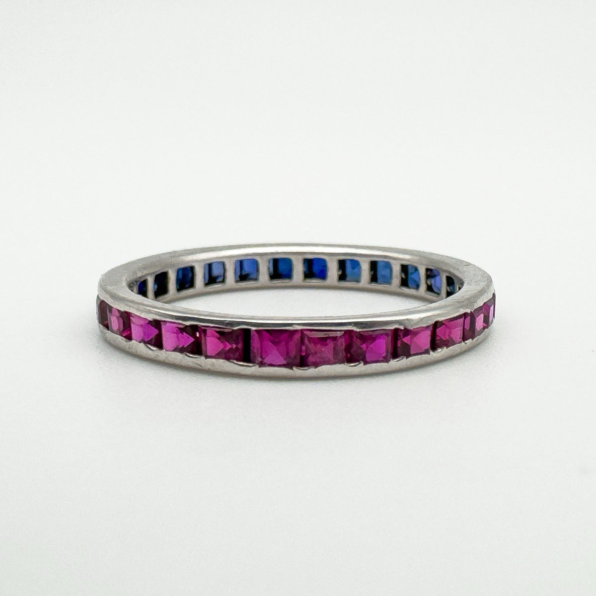 18ct white gold eternity ring showing full ruby side in polished setting