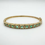 Vintage 9ct gold bangle with emeralds and diamonds front view