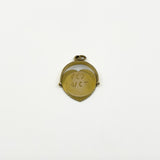 Reverse view of vintage 9ct gold heart spinning fob pendant showing engraved disc detail