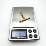 Vintage 9ct gold T-bar pendant weighing approx. 4.10g on digital scale