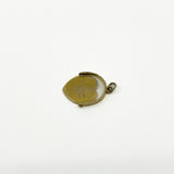 Angled view of vintage 9ct gold I Love You spinning fob pendant with moving centre disc