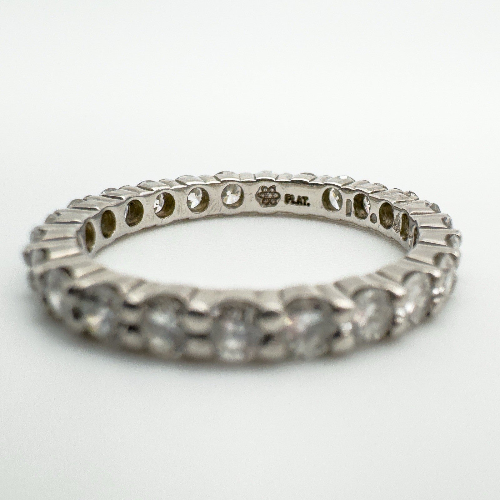 PLAT and Birmingham hallmarks visible inside diamond eternity band