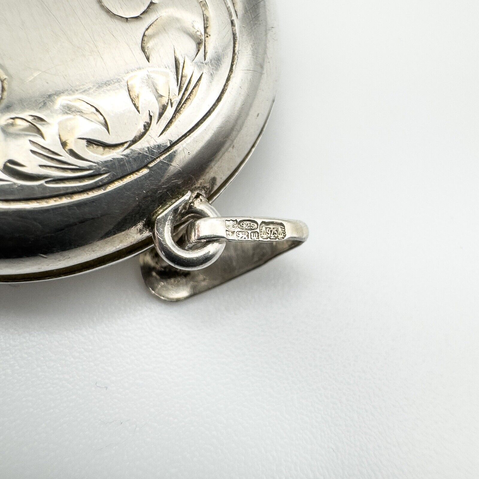 Engraved silver locket bail showing clear Birmingham silver hallmarks
