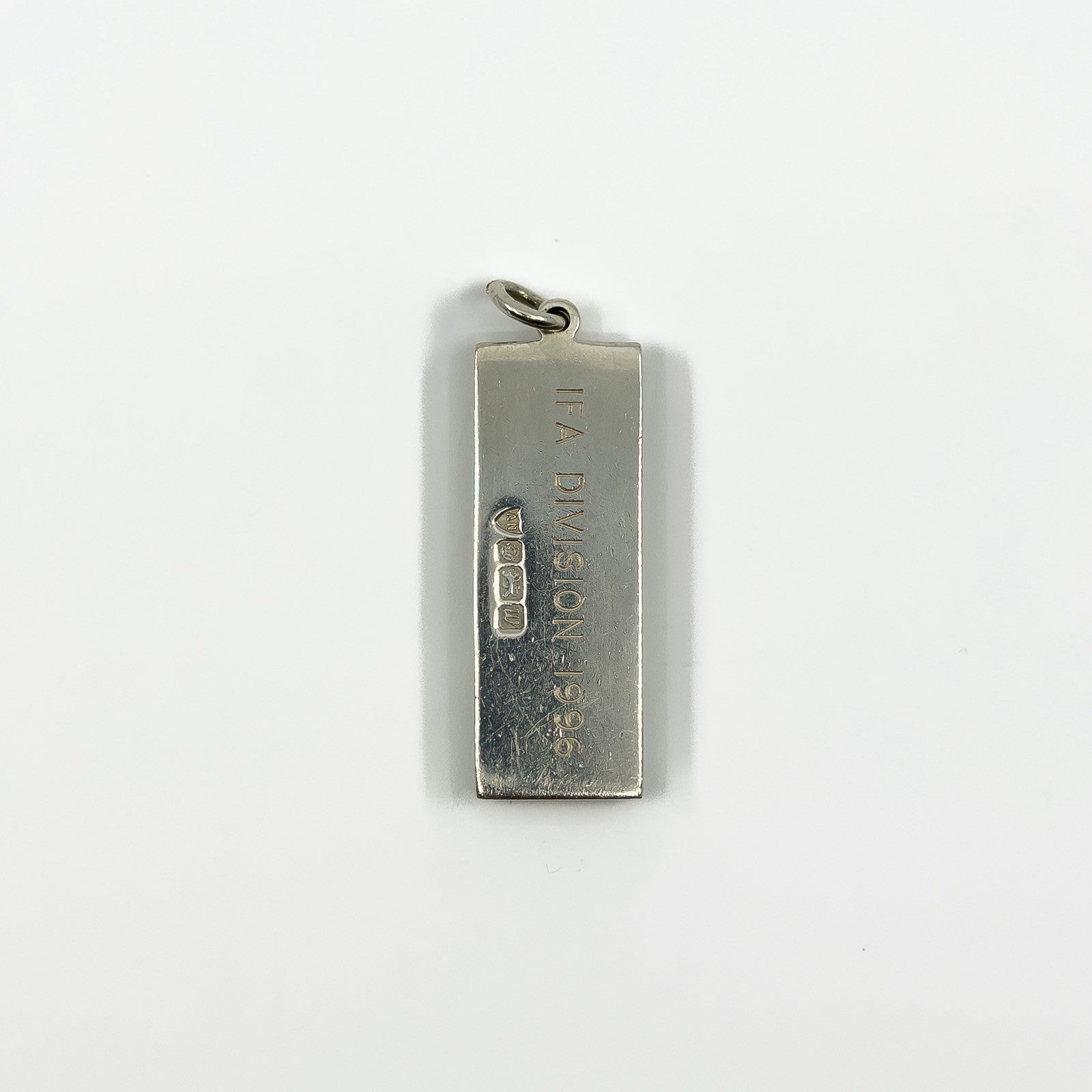 Back of the vintage sterling silver ingot pendant engraved IFA DIVISION 1996.
