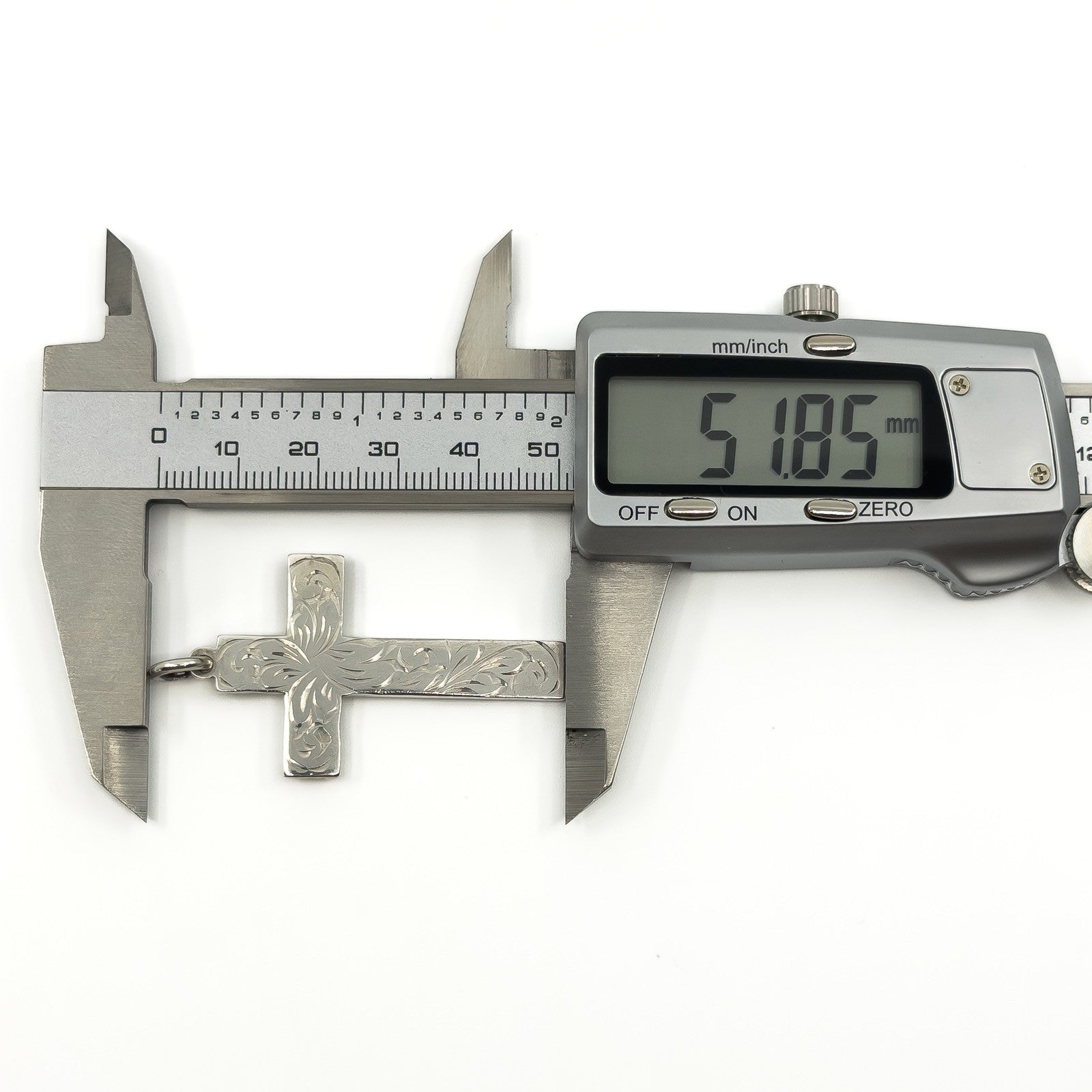 Vintage sterling silver cross pendant shown measuring approximately 51.8mm long.
