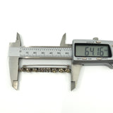Digital calipers showing the brooch length at approximately 64.16mm.