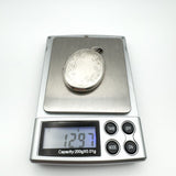 Foliate engraved sterling silver locket weighs 12.97 grams on digital scale