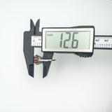 Digital caliper measuring depth of sterling silver carnelian ring at 12.6mm