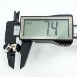 Side depth of sterling silver black onyx earring measured at approximately 7.4mm with callipers