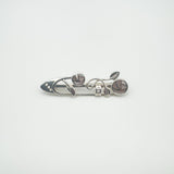 Overhead image of Celtic brooch with mother of pearl rose design