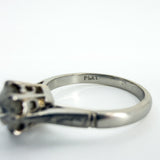 Close up of PLAT stamp inside antique platinum old-cut diamond solitaire ring