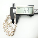 Measuring baroque pearl diameter at 6.9mm with digital calliper
