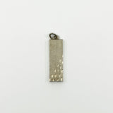 Plain reverse side of chunky vintage sterling silver ingot pendant with textured finish