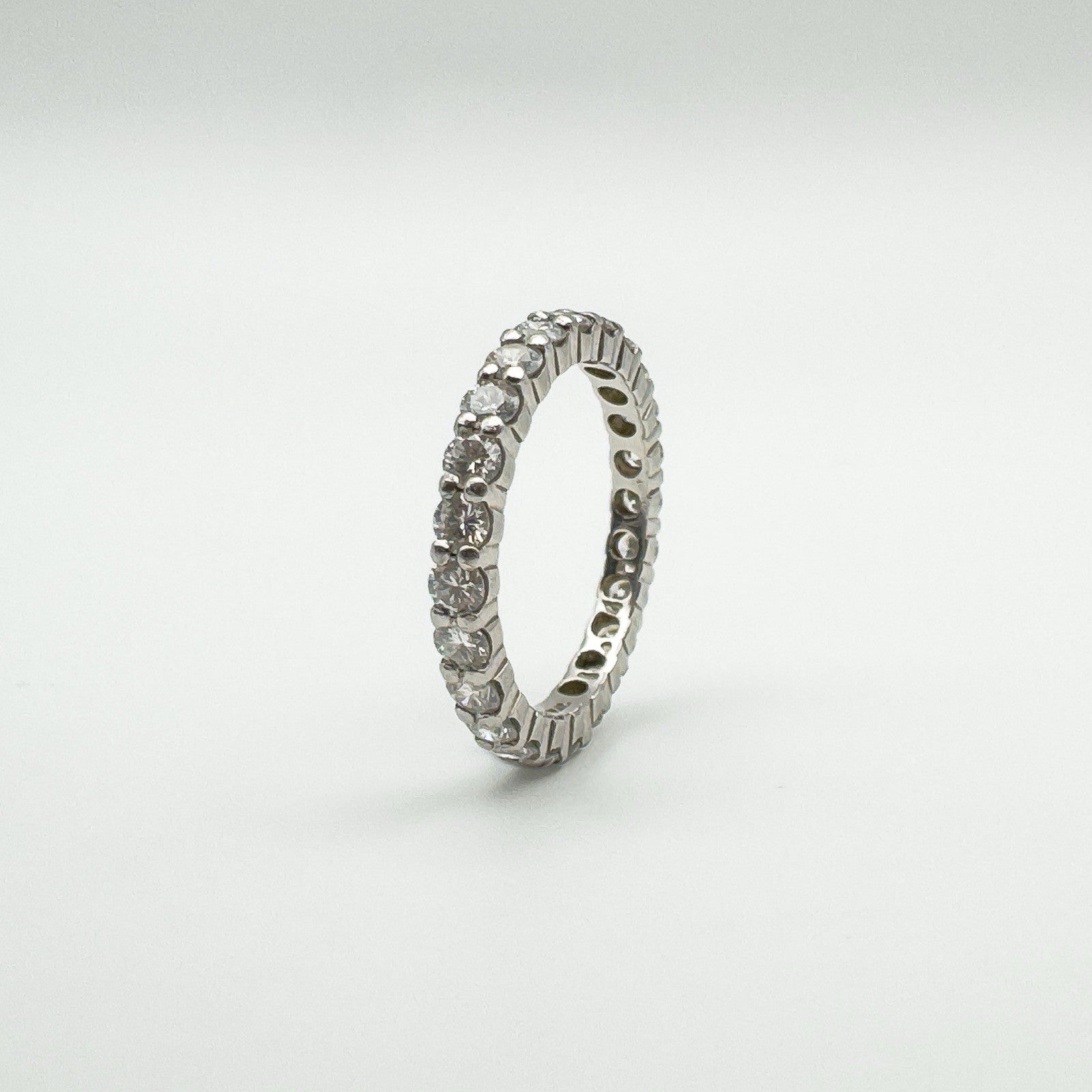 Platinum diamond full eternity ring shown upright to display side profile